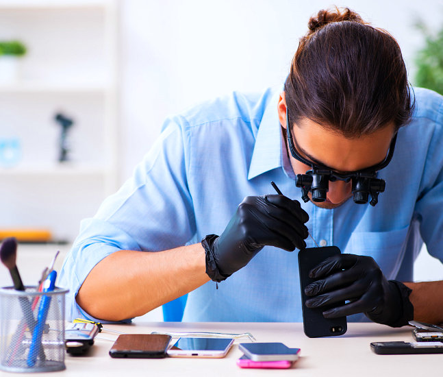 a man repairing a phone